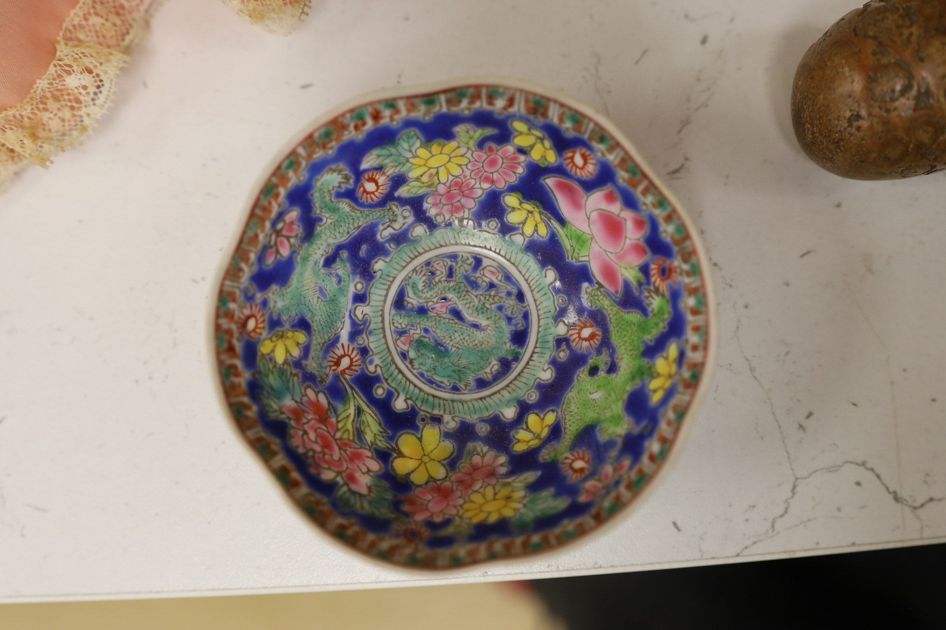 A pair of Chinese enamelled porcelain bowls, an eggshell bowl and a blue and white dragon bowl, turquoise bowls 11cm diameter (4). Condition - fair